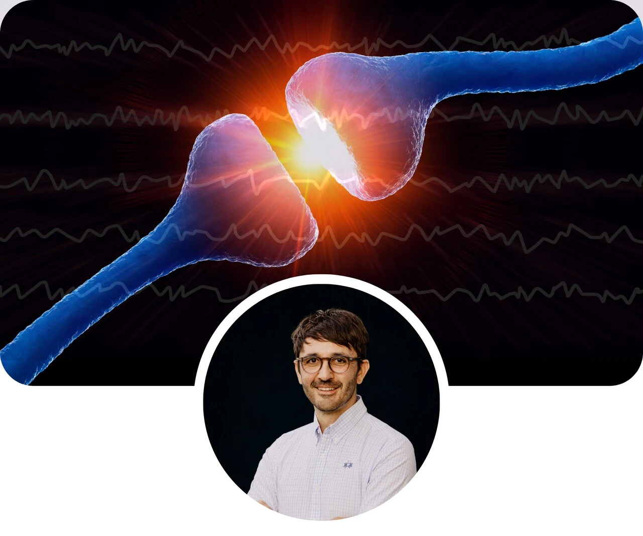 a man smiling with his arms crossed